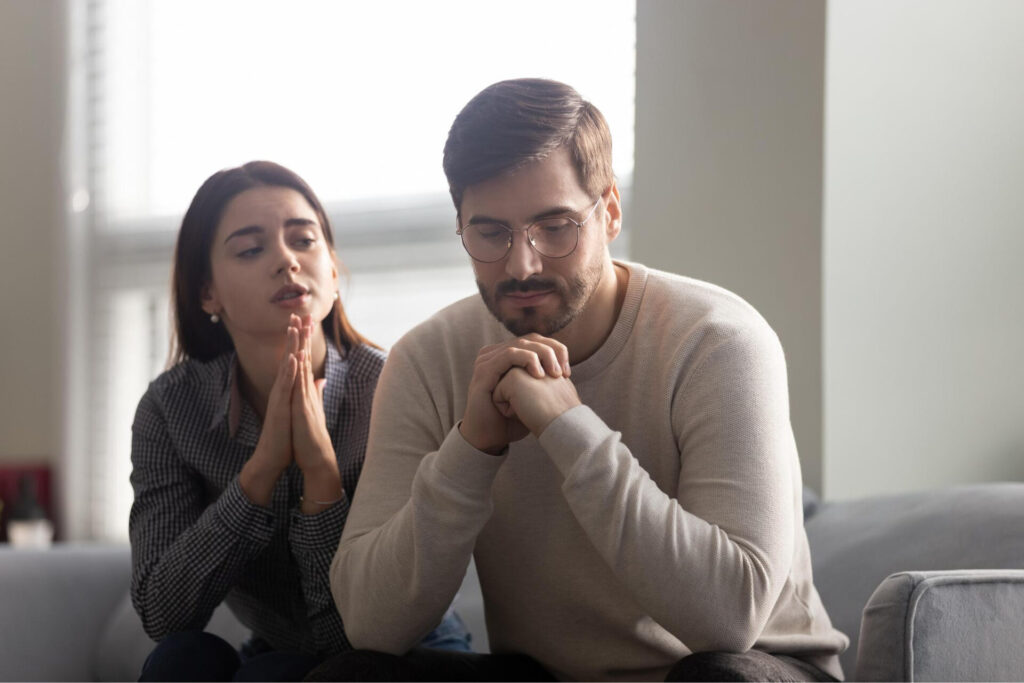 How to Rebuild Trust When Apologies: a man and woman praying together