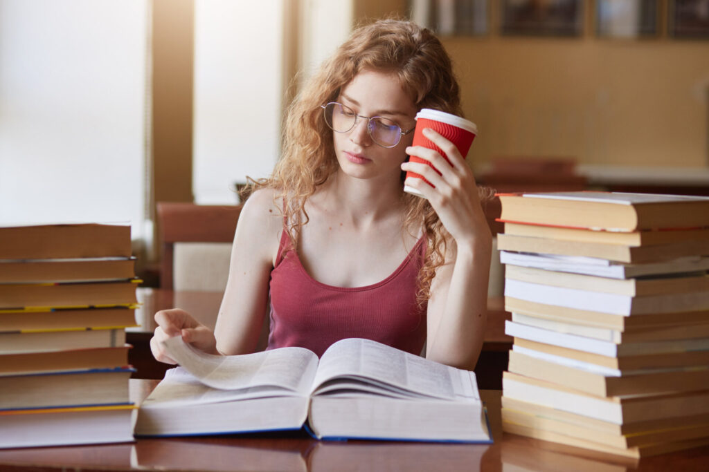 a woman reading a book - speed reading strategies