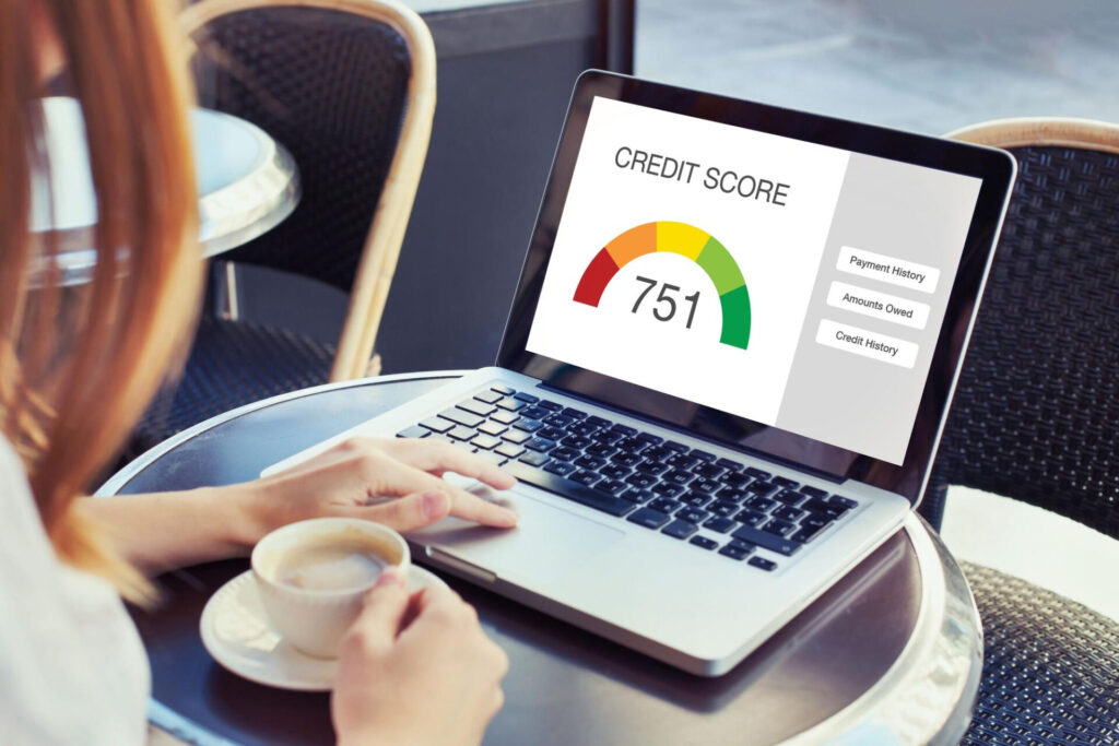 a person using a laptop - increase credit score quickly