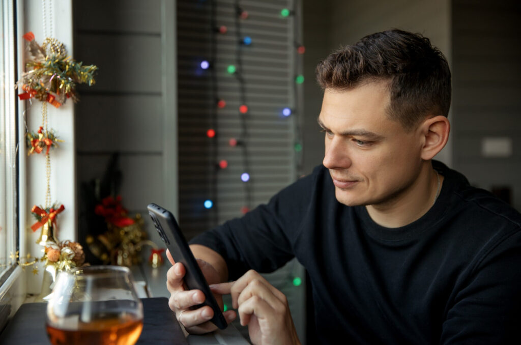a man looking at a phone