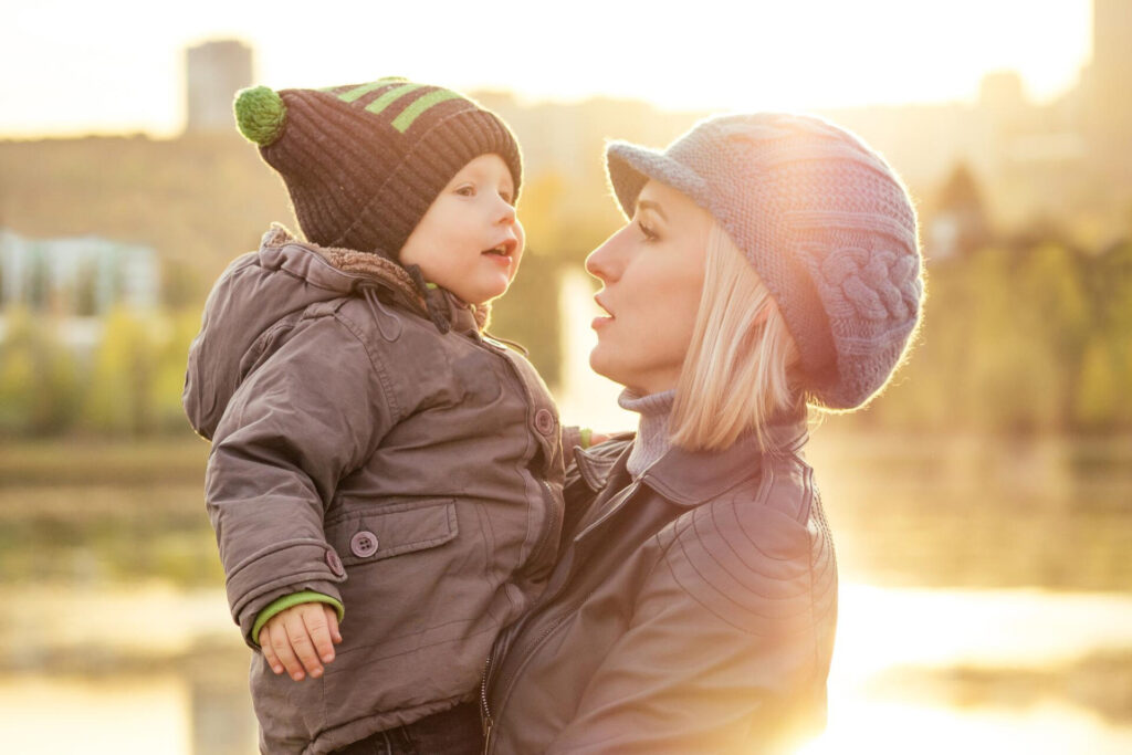 a woman holding a baby