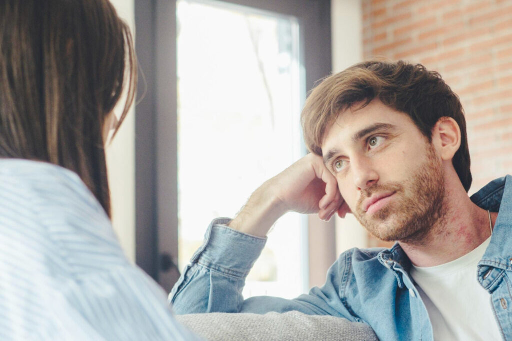 a man and woman looking at each other
