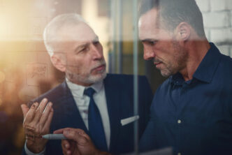 How to Give Constructive Feedback Effectively: a man writing on a glass wall