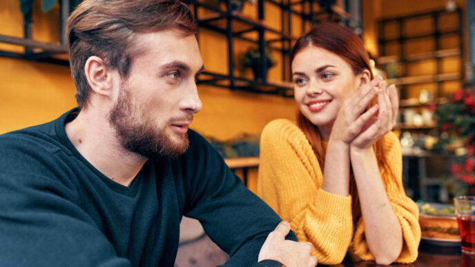 How to Build Rapport Quickly and Naturally: a man and woman sitting at a table