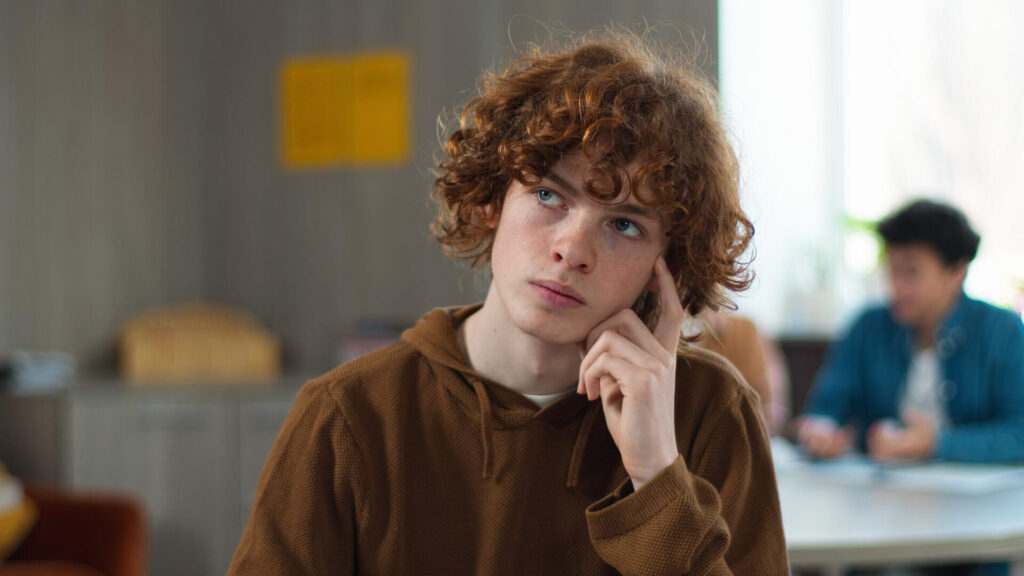 a student with curly hair - critical thinking skills for college students