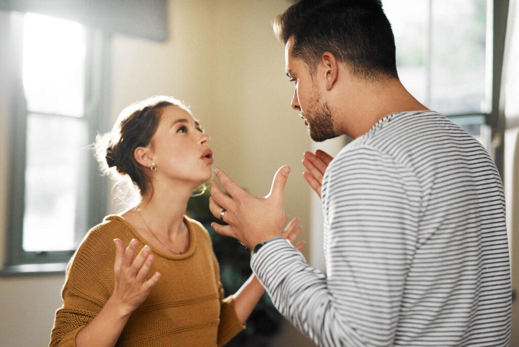 how to say no without feeling bad: a man and woman looking at each other