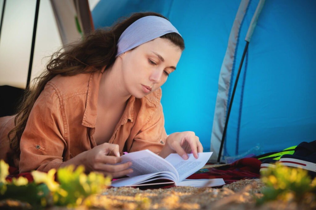 a woman reading a book - best ways to improve reading comprehension