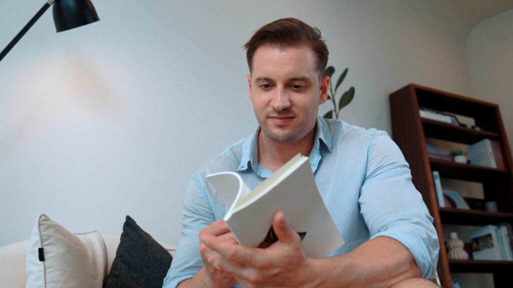 a man reading a book - reading comprehension strategies for adults