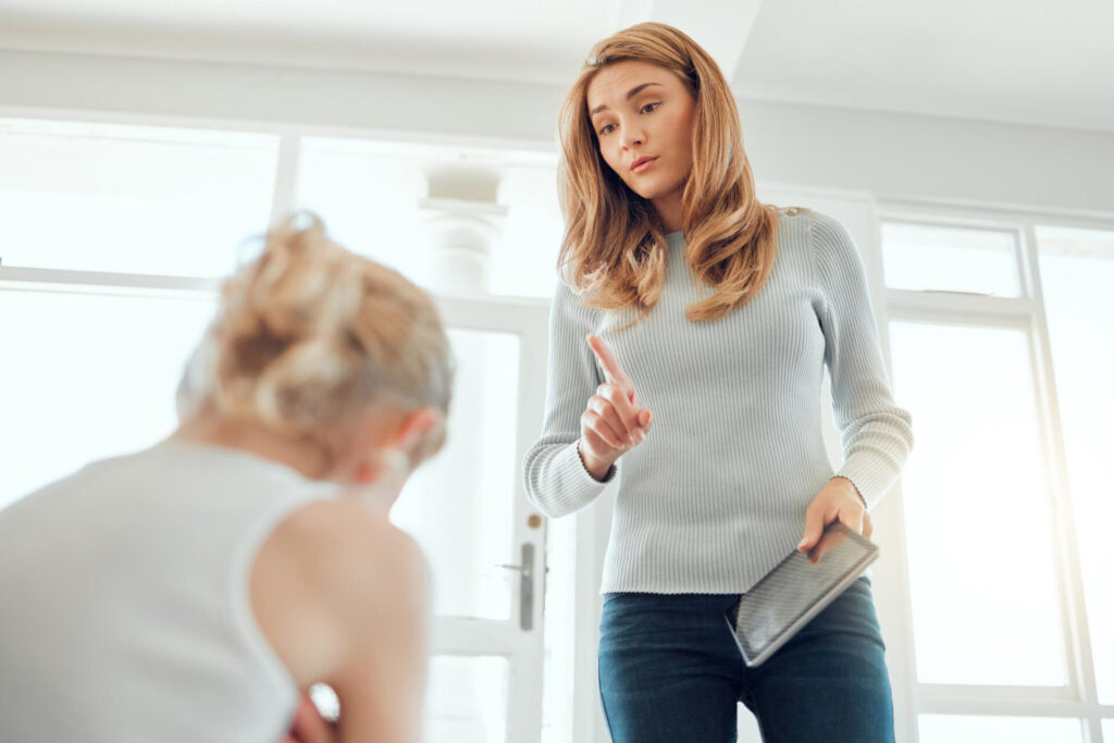 a woman pointing at a child