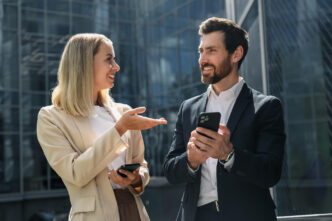 Mirroring Body Language in Sales: a man and woman standing outside looking at each other