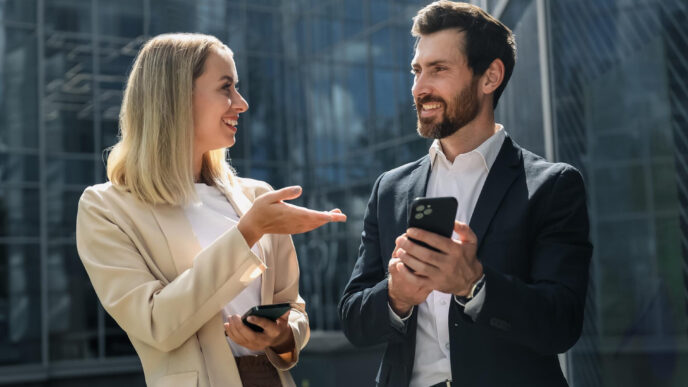 Mirroring Body Language in Sales: a man and woman standing outside looking at each other