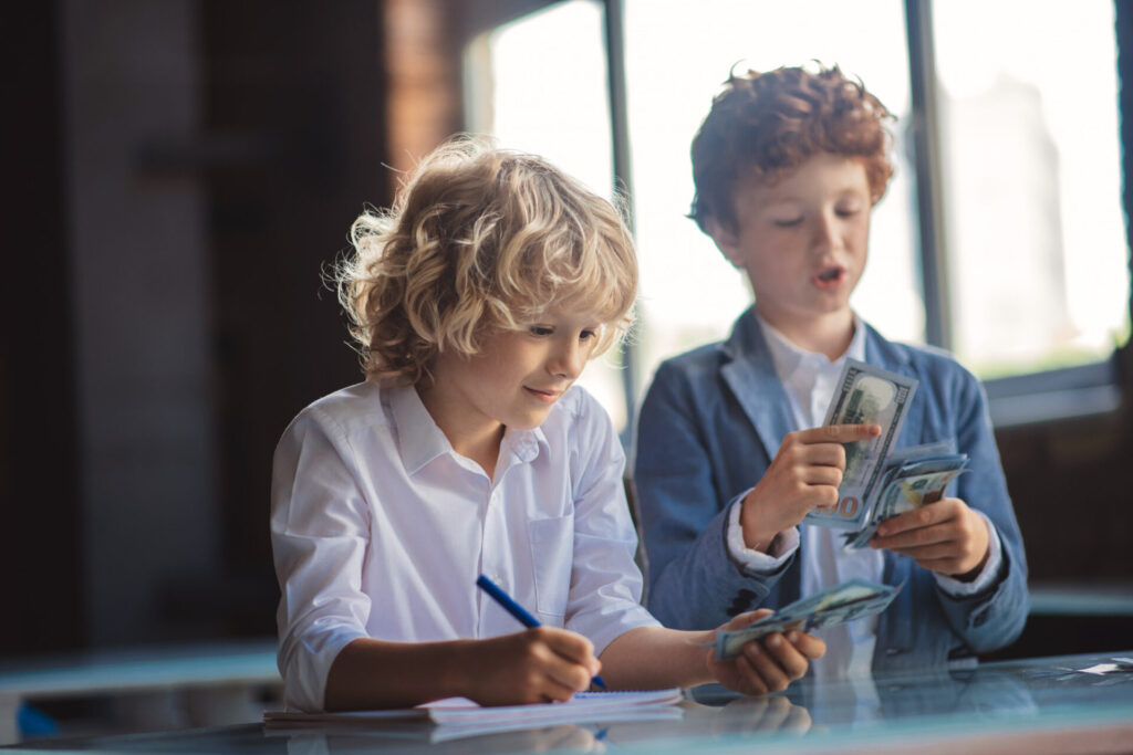 a group of boys counting money