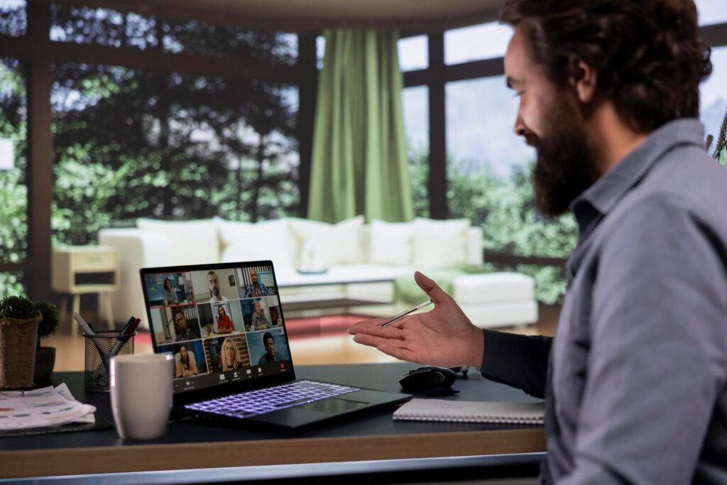 how to run a remote brainstorming session: a man sitting at a desk with a laptop