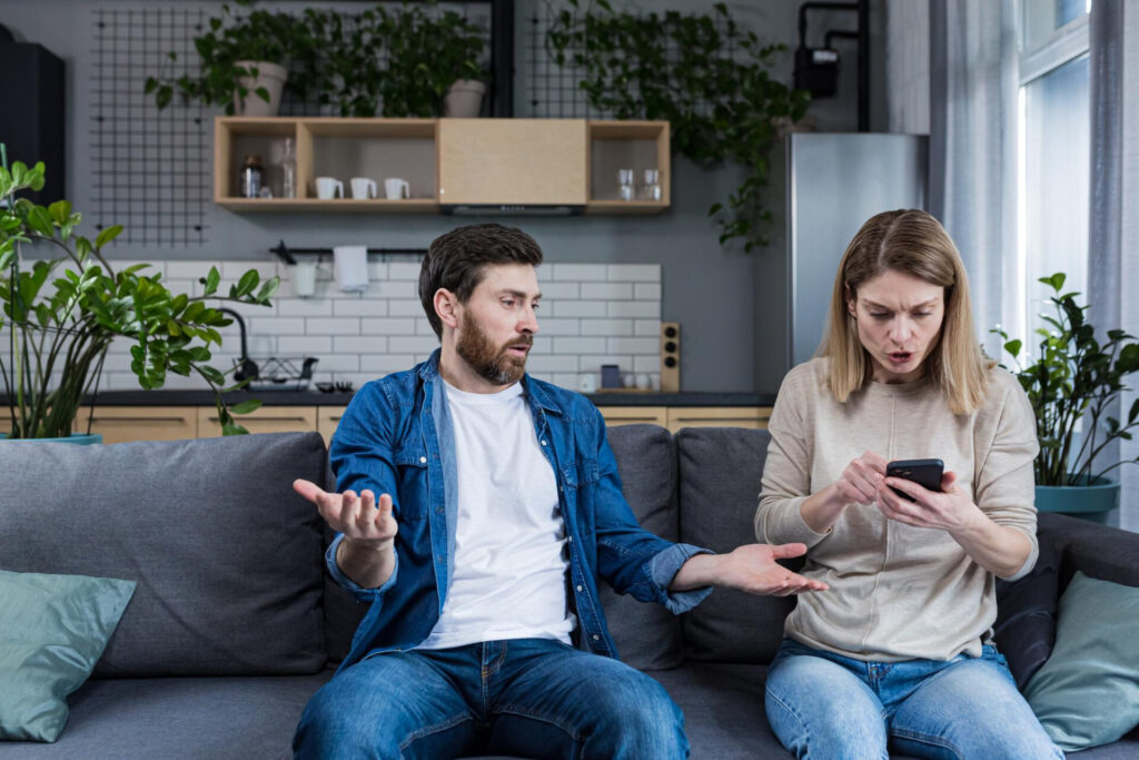 a man and woman sitting on a couch