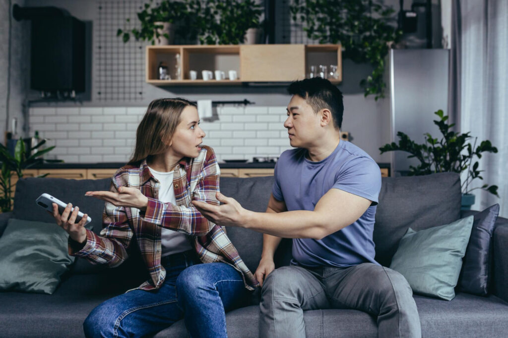 a man and woman sitting on a couch